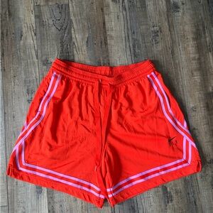 Women’s Nike fly shorts. Vibrant orange and purple stripes
